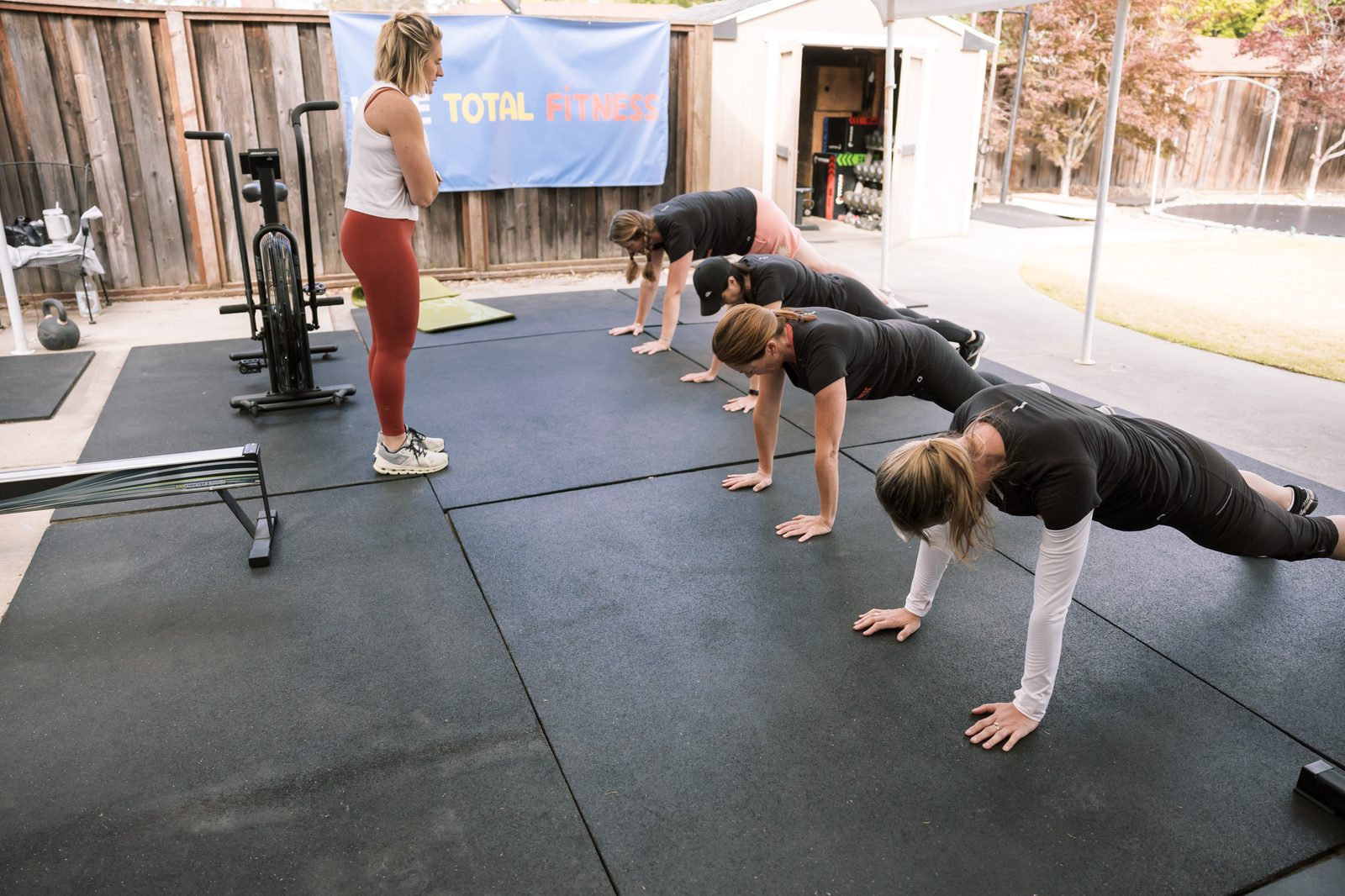 A group class in Kristin's backyard gym